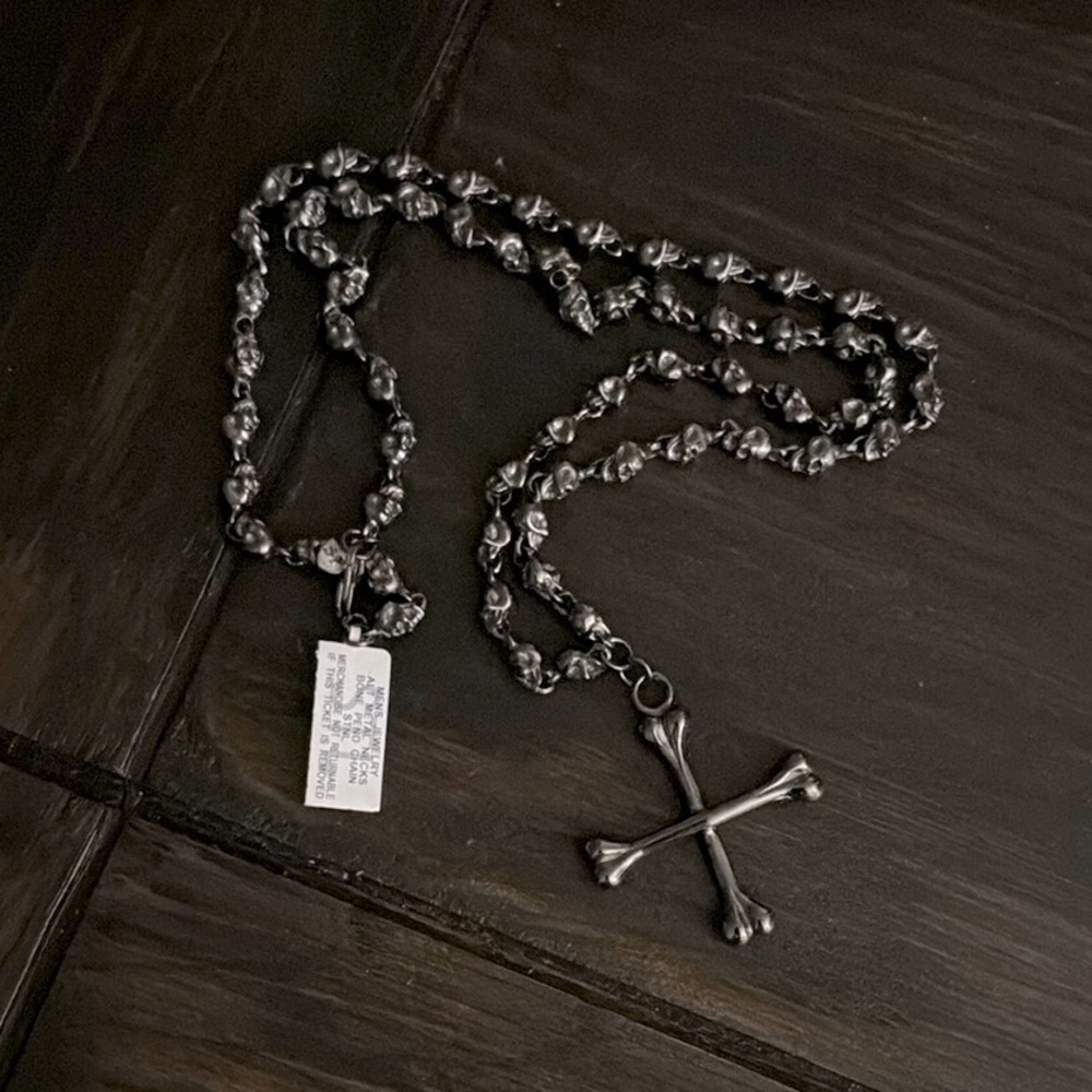 Bone cross necklace with skulls